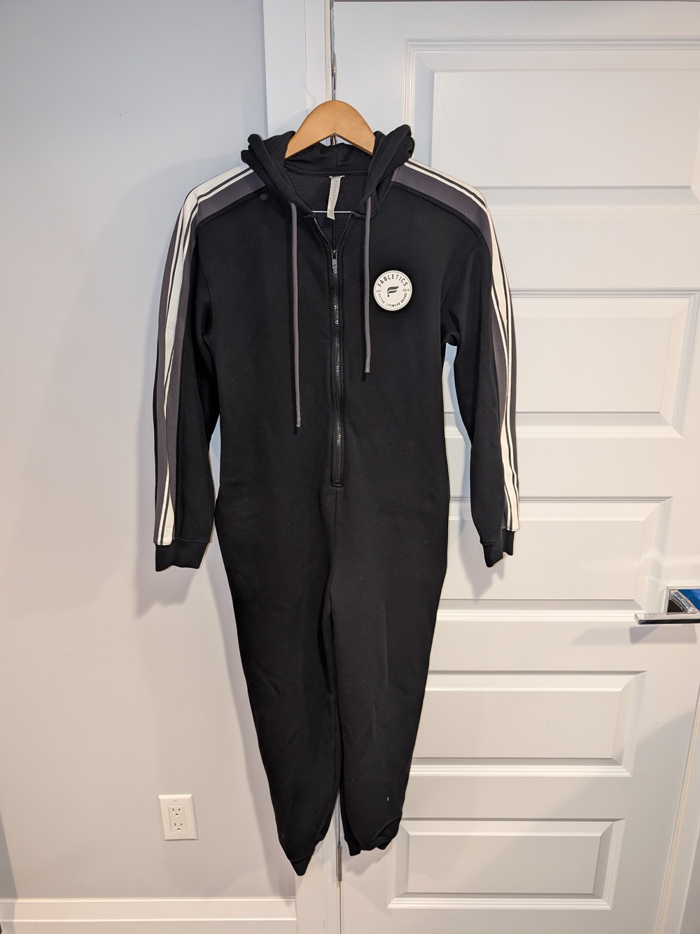 Fabletics Black One-Piece Hooded Jumpsuit with White Stripe Detail